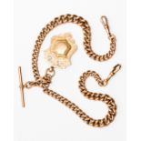 A 9ct gold Albert chain with scroll, links marked, suspended with a cartouche fob,
