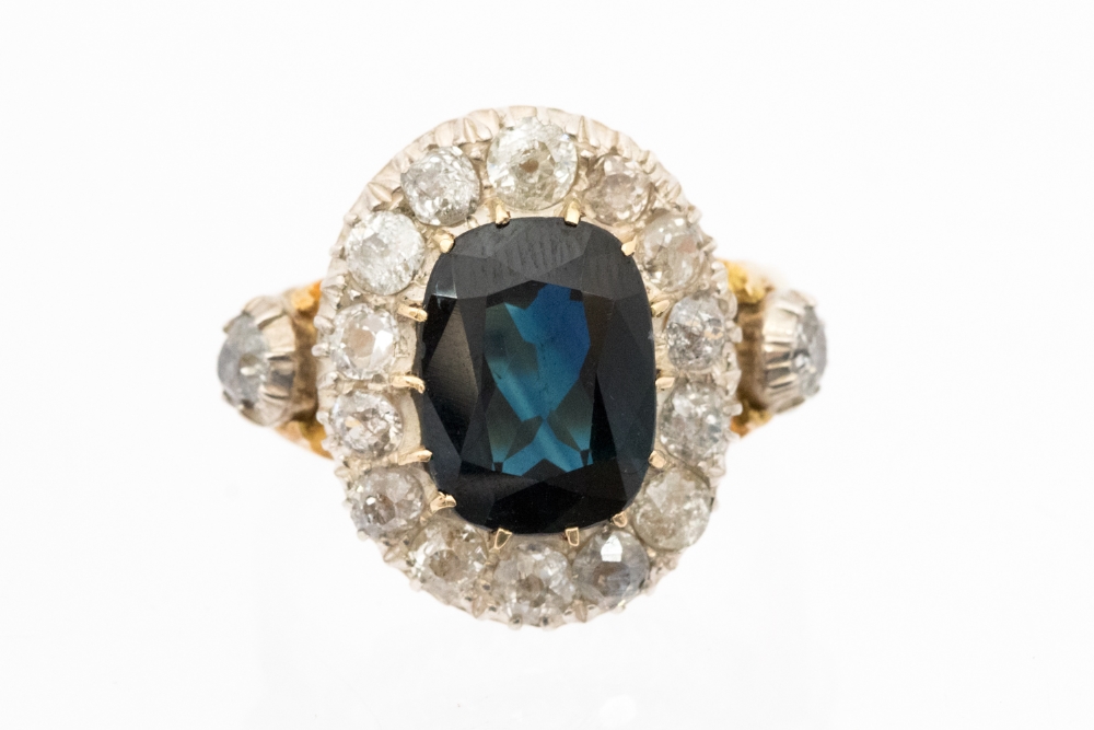 A large sapphire and diamond cluster 18ct yellow gold ring,