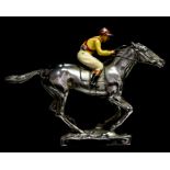 A novelty chromium plated car mascot in the form a horse and jockey,