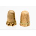 A Victorian two tone gold thimble, with shield vacant cartouche before foliate band,