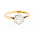 A diamond solitaire yellow gold ring,