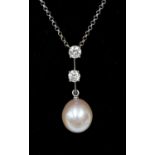 A pearl and diamond pendant, the pearl measuring approximately 14 x 12 mm,