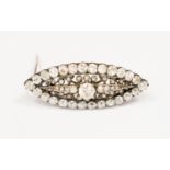 An early 20th Century diamond cluster brooch,