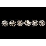 A set of six late Victorian cast silver buttons, each with floral decoration,