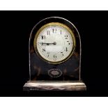 A George V silver cased mantle clock, with French movement, Arabic numerals,