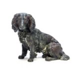 A Viennese cold painted bronze figure of a seated spaniel, early 20th Century,