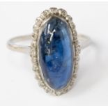 A sapphire and diamond white metal dress ring,