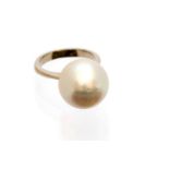 A single pearl and white metal ring, the slightly oval pearl measuring approximately 15 x 14 mm,
