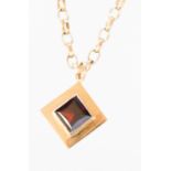 A nine carat gold garnet set square pendant and chain, approx 24.