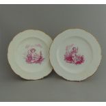 A pair of Minton plates, centre decorated in purple with Putti, circa 19th Century,