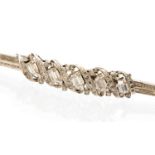 A diamond and white metal bracelet, the central mount set with five baguette cut diamonds,