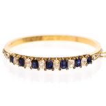 A graduated sapphire and diamond yellow metal bracelet,