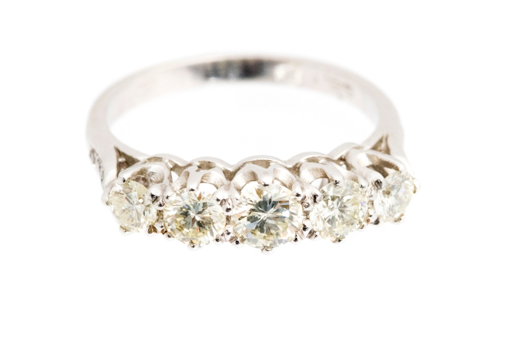 A diamond five stone white gold ring, five round brilliant cut diamonds,