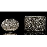 An Edwardian silver box, of ovoid form, with hinged cover embossed with a landscape scene,