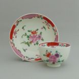 A Lowestoft polychrome tea bowl and saucer,