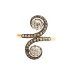 A diamond and yellow metal dress ring,