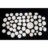 A series of approximately fifty six cast plaster miniature cameo roundels,