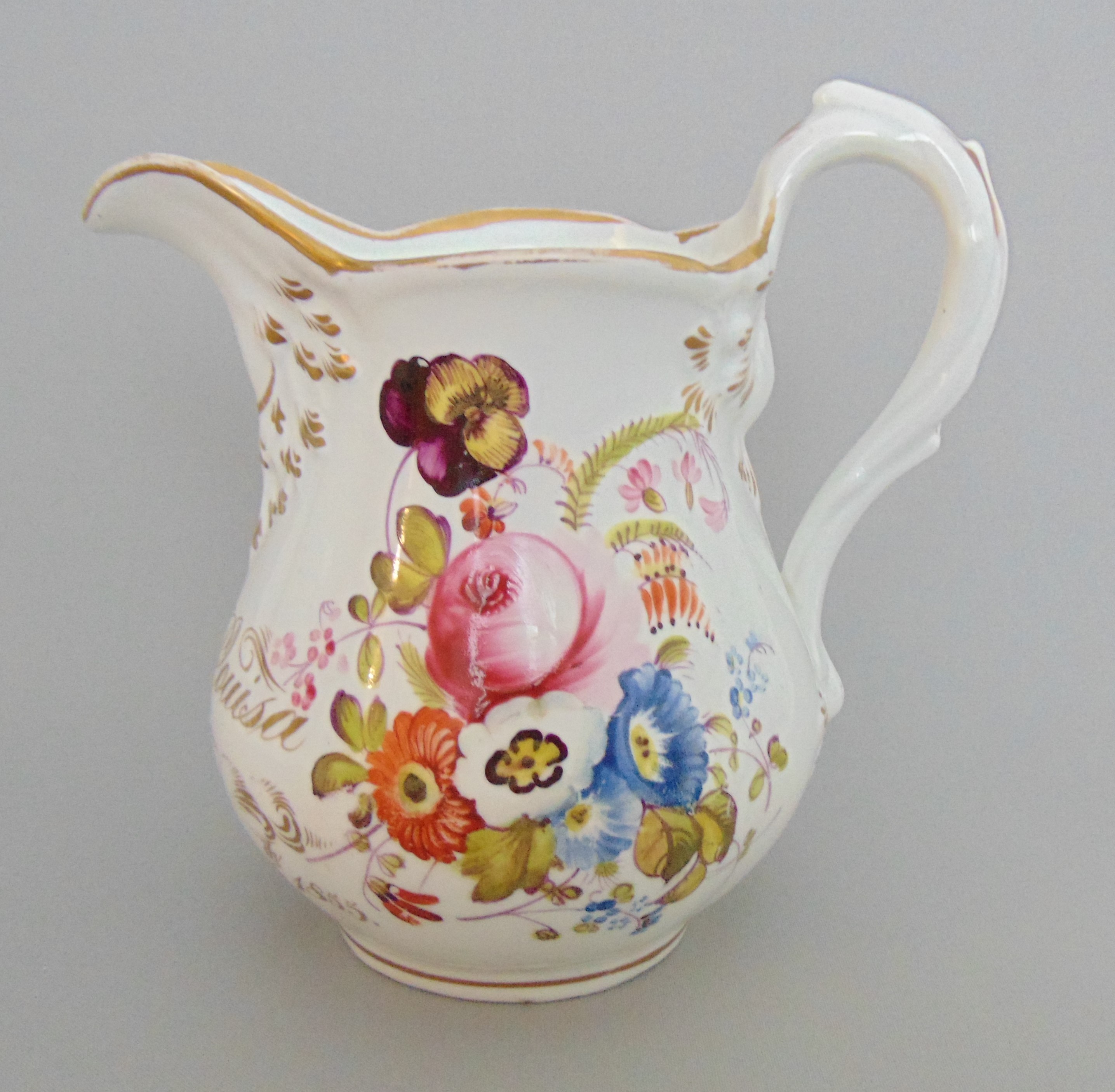 A Coalport jug inscribed and dated 1855, floral decoration and gold embelishments, circa 1855,