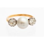 A button pearl and diamond three stone ring, the button pearl 9mm assessed as natural,