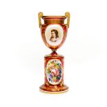 A 19th Century Bohemian ruby glass twin handled vase on a pedestal, circa 1860,