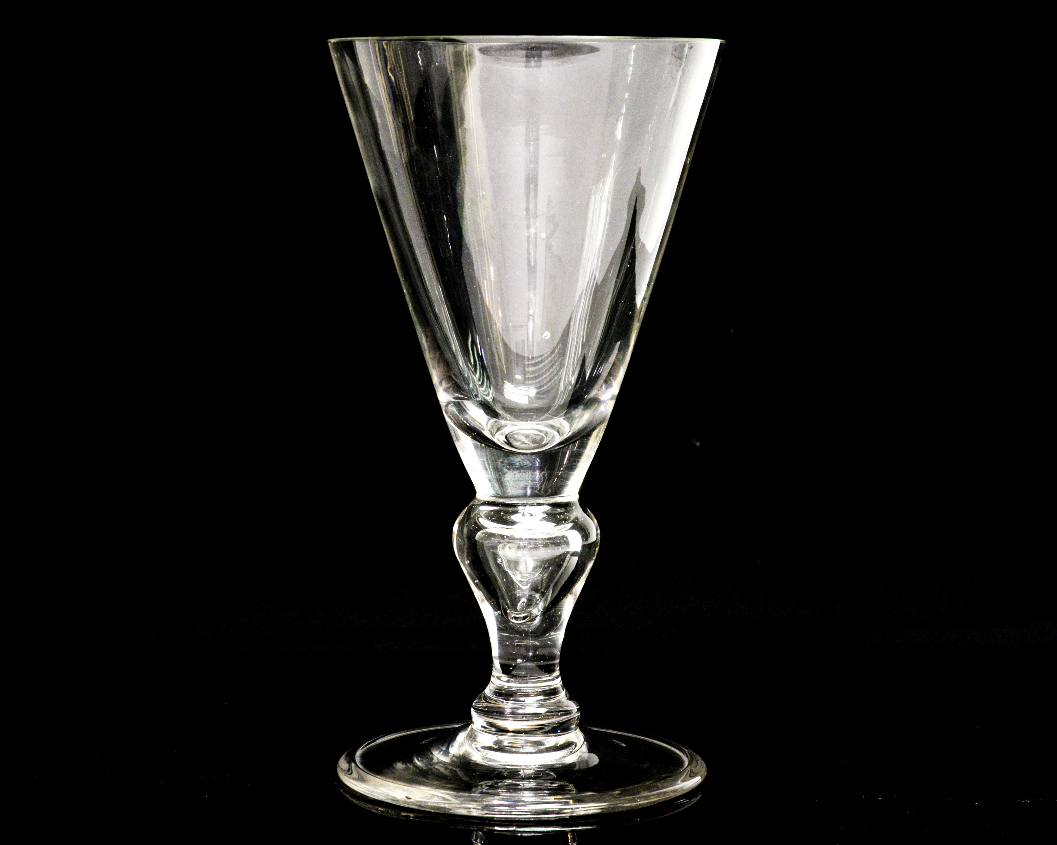 A heavy baluster wine glass, or large proportions, probably Continental,