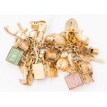 A 9ct gold charm bracelet together with 27 assorted charms and padlock fastener,