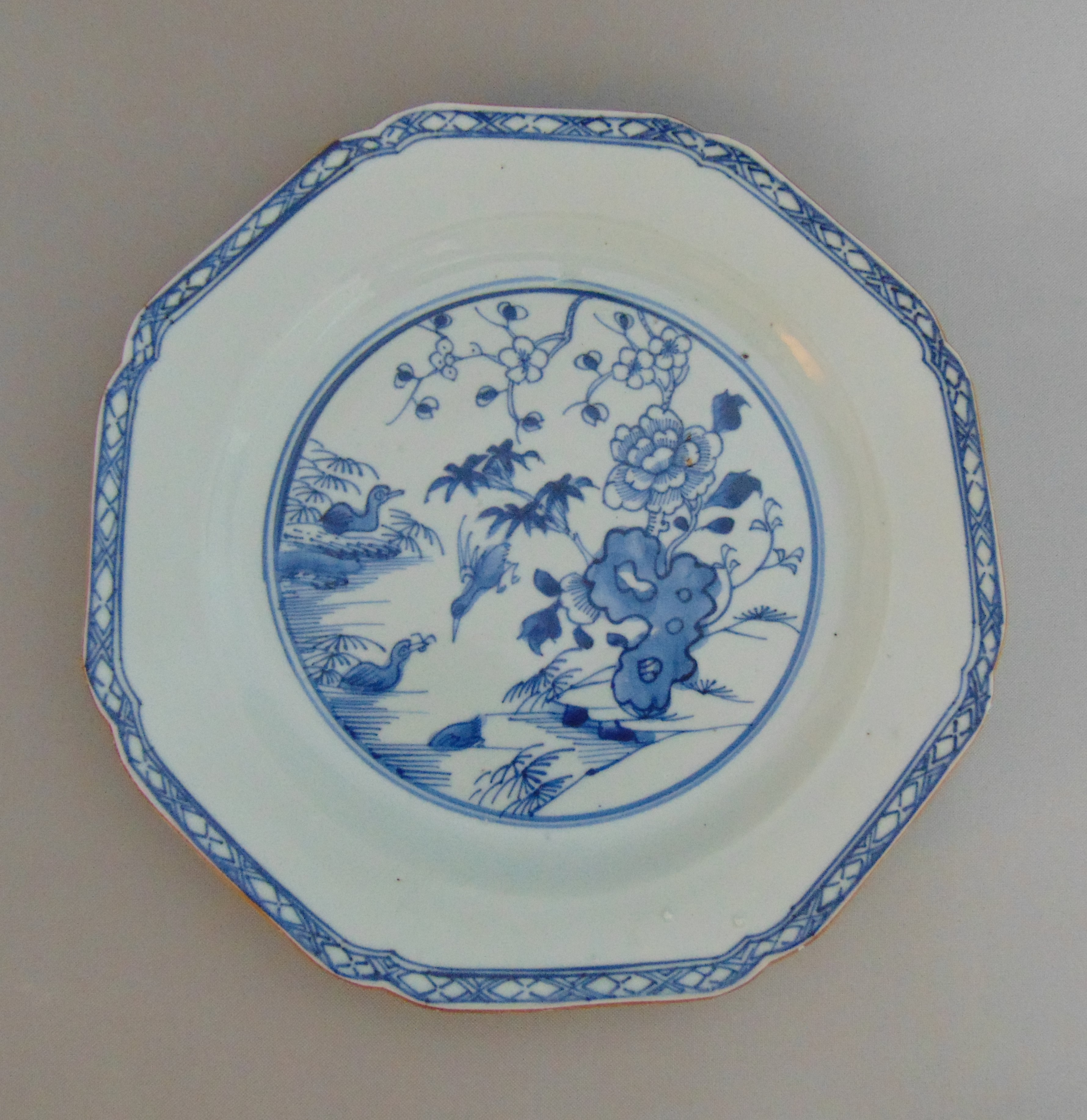 An 18th Century Chinese octagonal plate decorated in blue and white, 21.