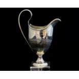 A George III silver bright cut milk jug,