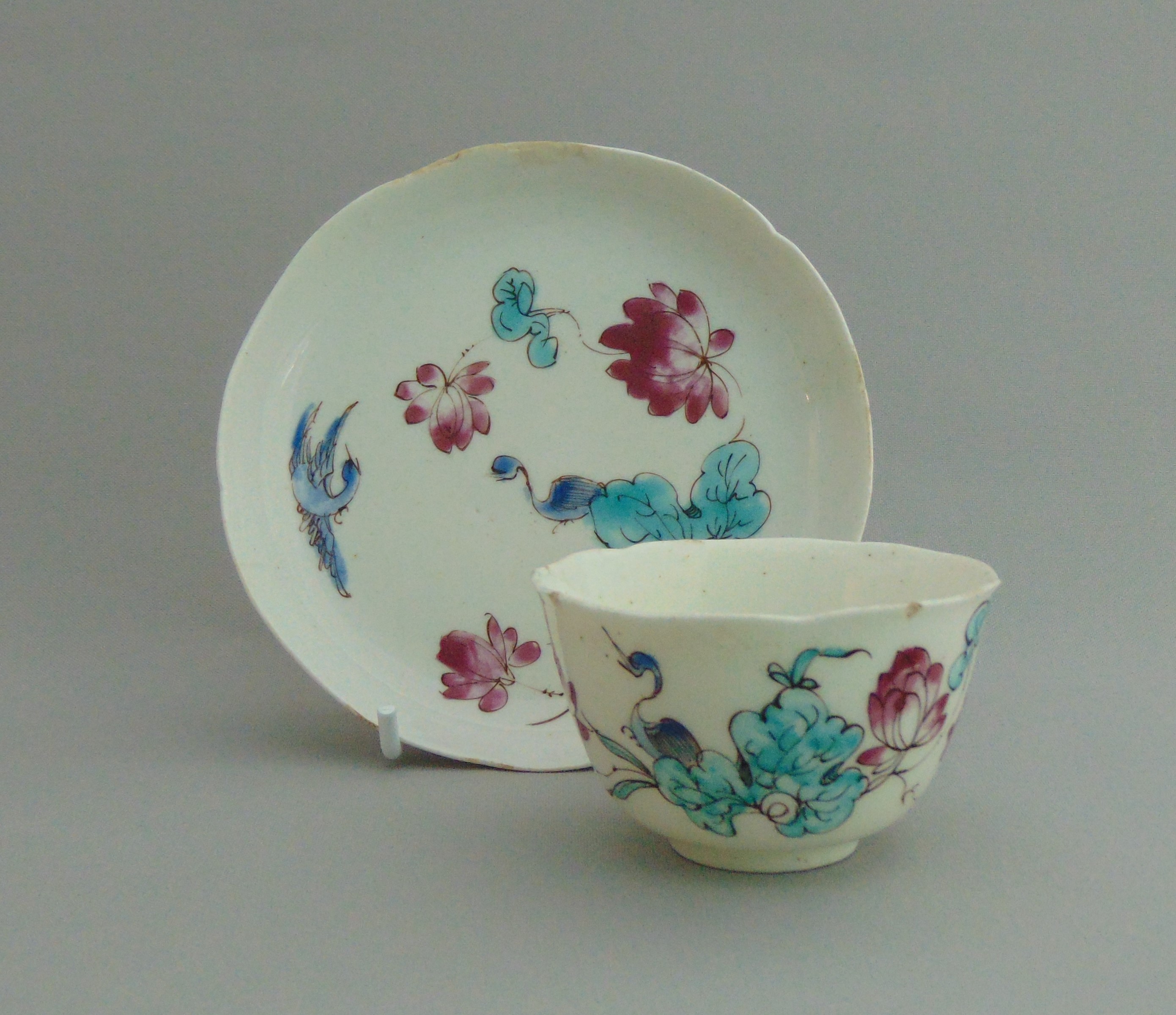 A Bow Tea Bowl and Saucer with Famille Rose type decoration, circa 1754, tea bowl 7 cm diameter,