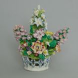 An unusual Bow basket of flowers, an open weave basket bursting with colourful blooms, circa 1765,