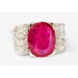 ***Auctioneer to announce the ruby is a lead glass filled ruby*** A ruby and diamond white metal