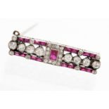 An Art Deco ruby and diamond set small bar brooch, white metal unmarked, approximately 5.