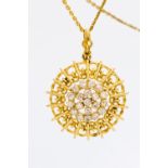 A diamond pendant of sunburst openwork design,