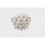 A diamond flower head cluster ring,