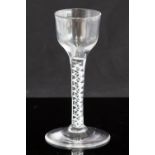 An 18th century wine glass, circa 1755, the plain ogee bowl supported on an opaque,