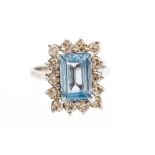 An aquamarine and diamond rectangular cluster 18ct white gold ring,