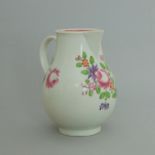 A Worcester polychrome sparrow beak cream jug, decorated with a rose & flowering sprigs,