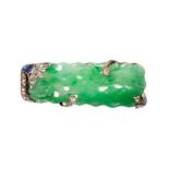 A carved Jadeite panel brooch with diamond and sapphire surround