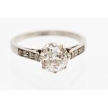 A diamond solitaire ring with diamond shoulder,