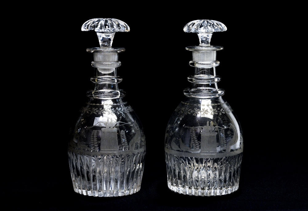A pair of George III glass decanters and stoppers, circa 1810, mallet form,