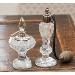 Two pedestal cut glass perfume bottles,