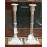 A pair of Victorian silver candlesticks on weighted bases, Martin Hall & Co,
