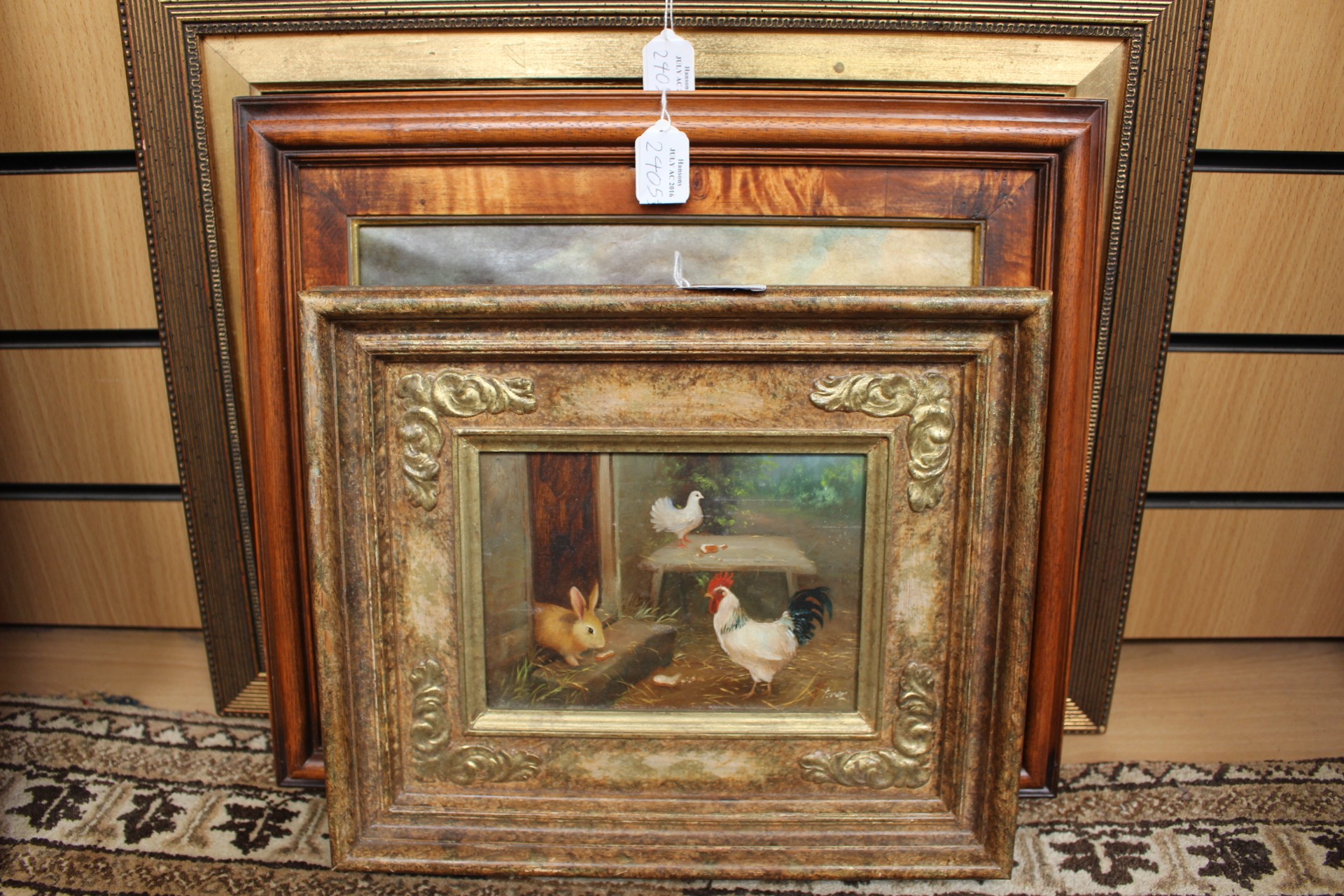 A 20th Century oil on board in the style of Hunt, cockerel, rabbit and dove,