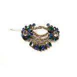 A Christian Dior 1950s brooch, set with clear, blue, green and iridescent paste stones,