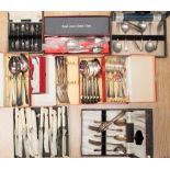 A box containing a collection of silver plated and steel cutlery,