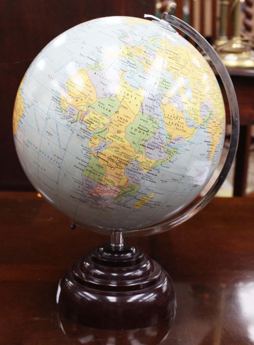 A 1940s desk globe with bakelite base,