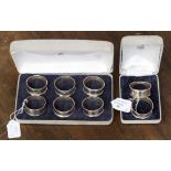 A cased set of six silver serviette rings,hallmark London 1987/88 with Greek key pattern,