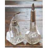 A tall narrow necked silver topped cut glass perfume bottle,