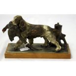A painted spelter desk lighter, modelled as a spaniel retrieving a cock pheasant,