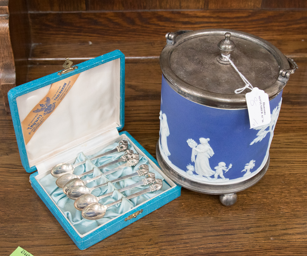 A Wedgwood biscuit barrel and six Thai silver spoons